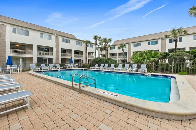 a view of swimming pool with outdoor seating
