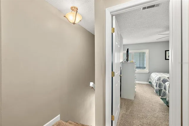 a view of a room with mirror and closet