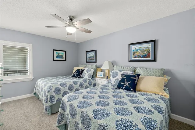 a bedroom with bed and a window