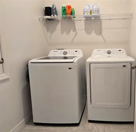 a utility room with dryer and washer