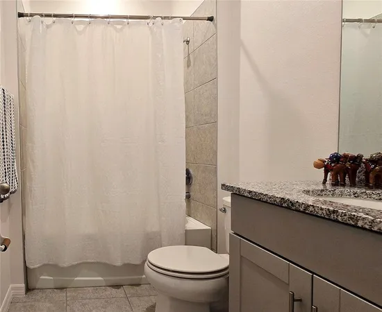 a view of a hardwood floor in a room