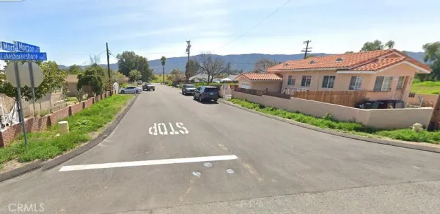 a view of building with a garden