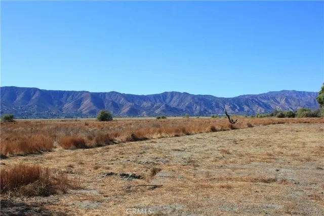 a view of barn and a yard