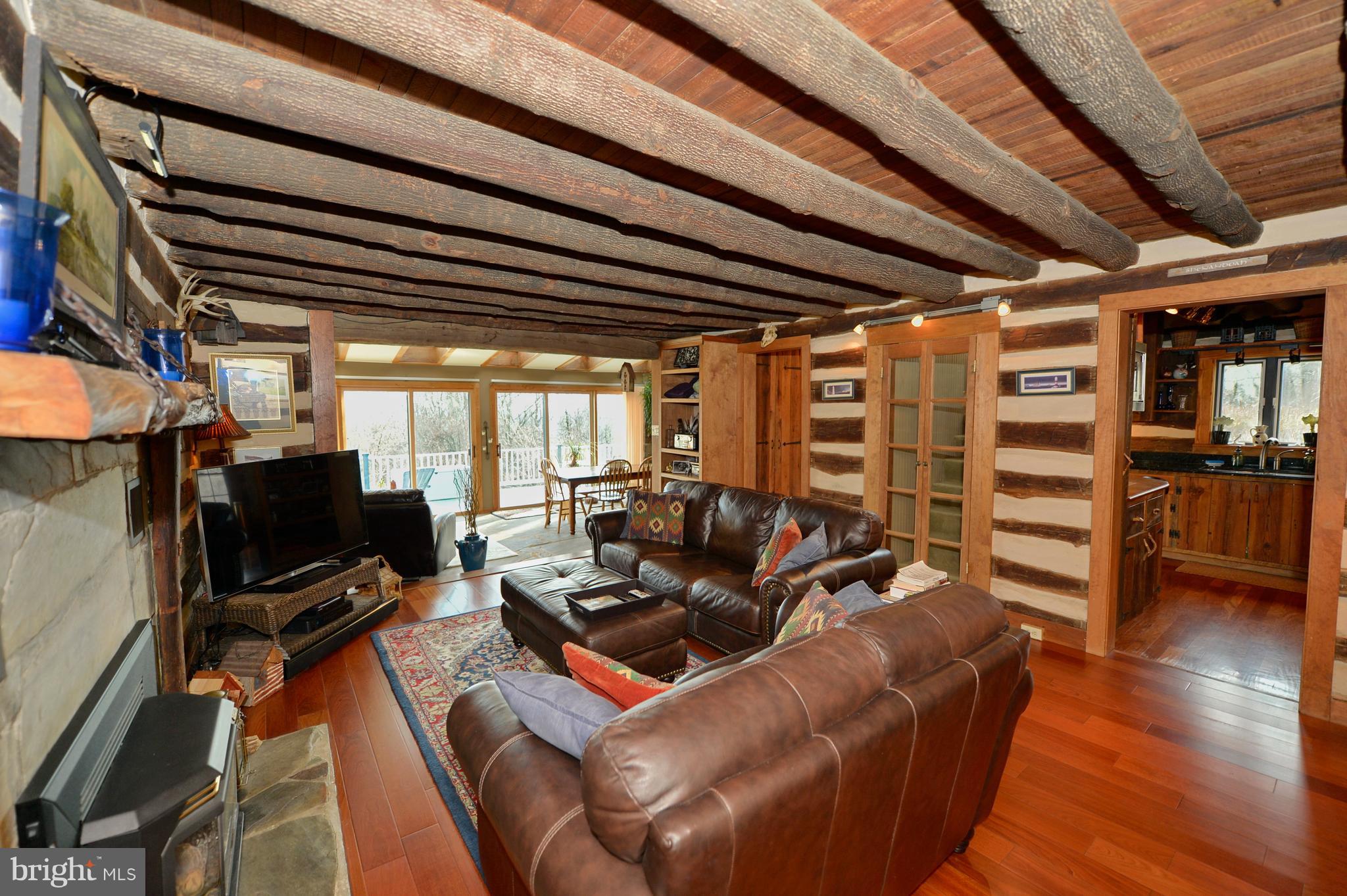 34973 Sunny Ridge Road Round Hill, VA 20141 - Photo 18 of 52 Family room view to kitchen & sun room