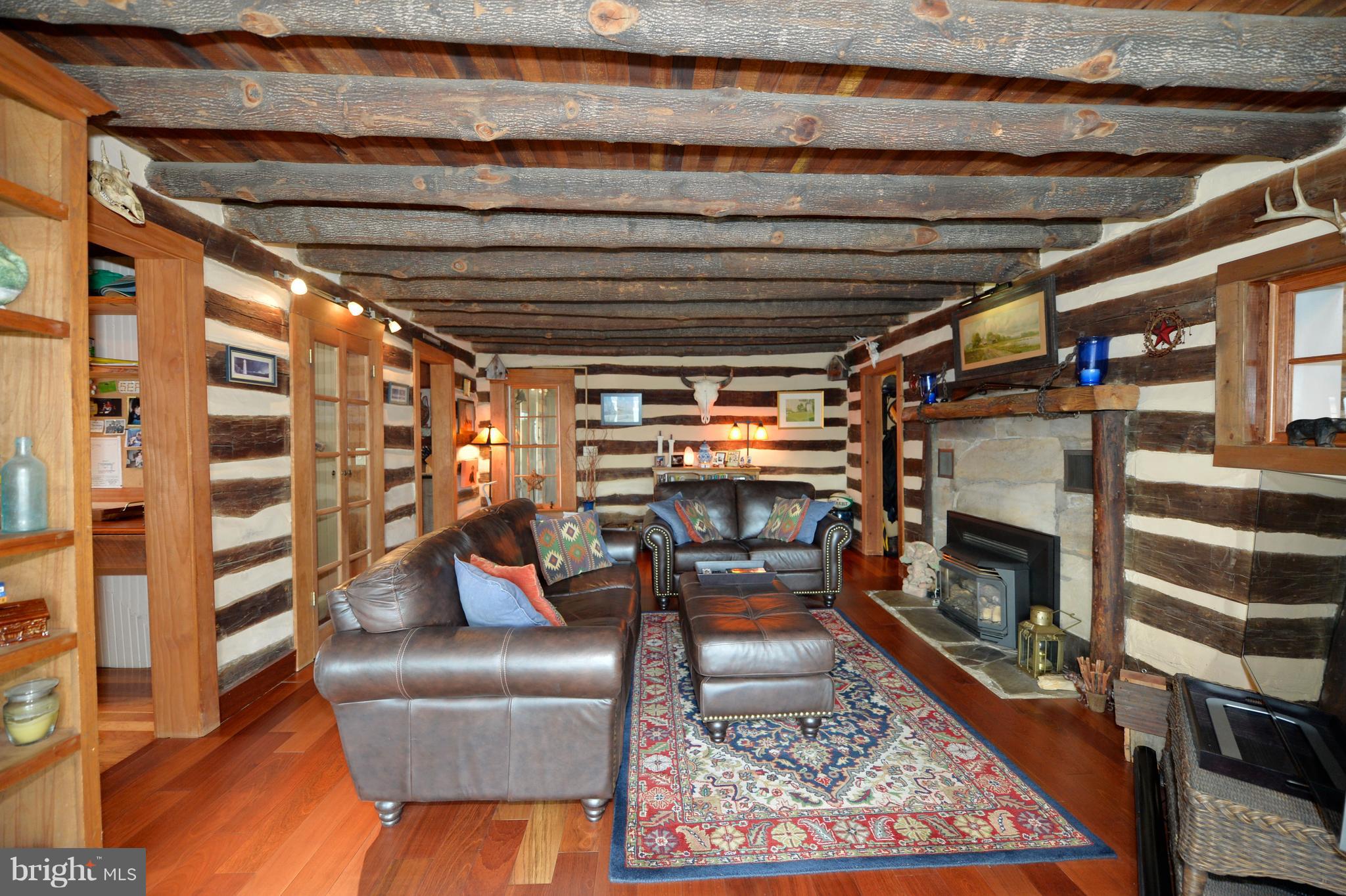 34973 Sunny Ridge Road Round Hill, VA 20141 - Photo 19 of 52 Original Log cabin living room with gas fireplace