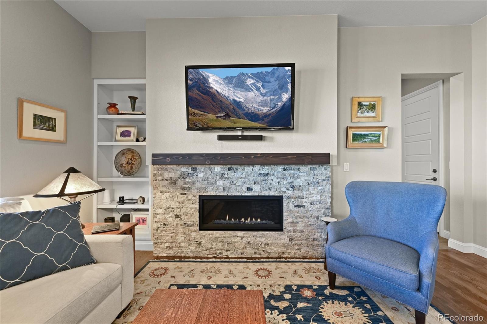 493 Meadowleaf Lane Highlands Ranch, CO 80126 - Photo 16 of 48 a living room with furniture and a fireplace