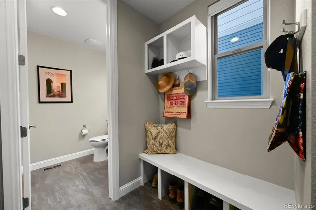 a bed room with a bed and a ceiling fan