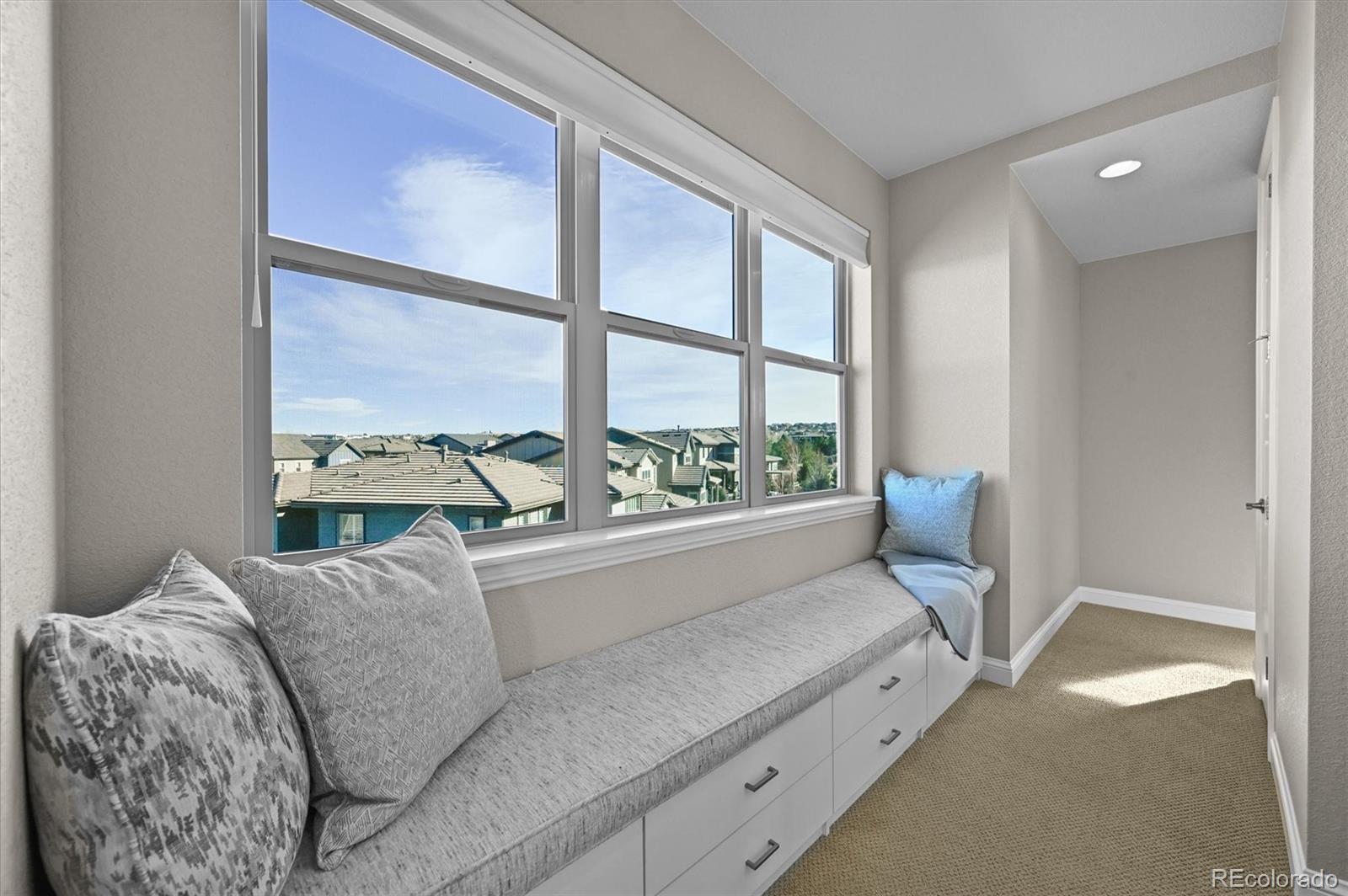 493 Meadowleaf Lane Highlands Ranch, CO 80126 - Photo 21 of 48 a living room with furniture and a large window
