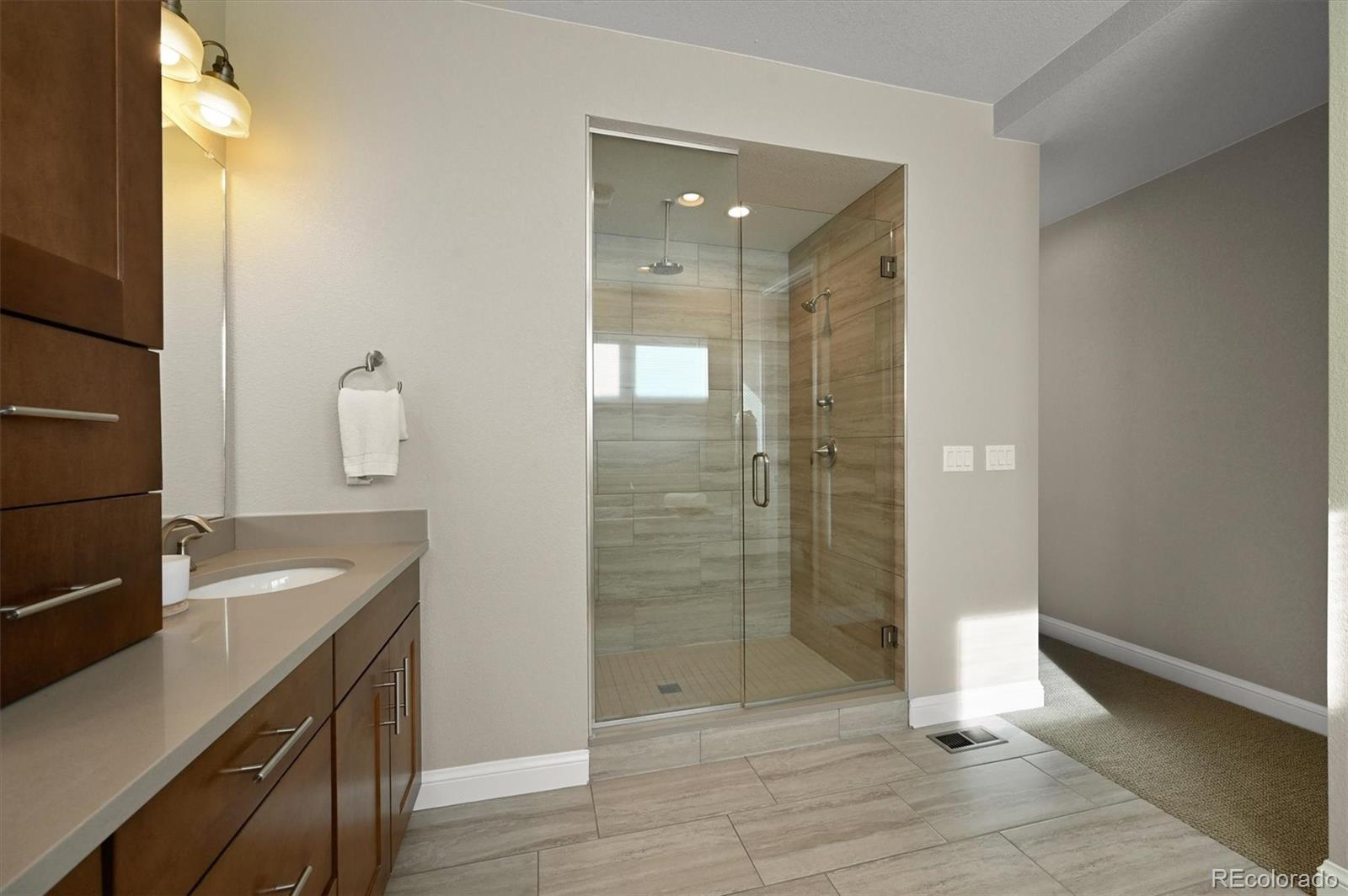 493 Meadowleaf Lane Highlands Ranch, CO 80126 - Photo 25 of 48 a bathroom with a shower