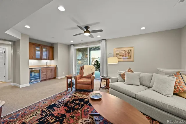 a view of a big house with a big yard and large tree