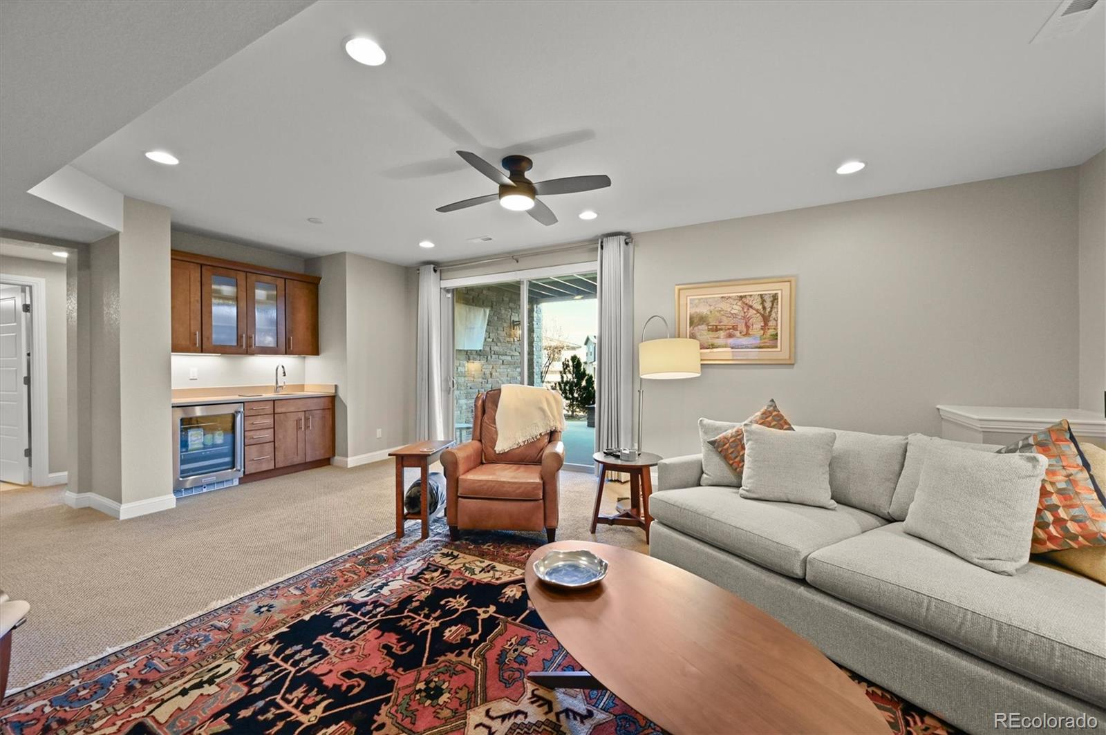493 Meadowleaf Lane Highlands Ranch, CO 80126 - Photo 32 of 48 a living room with furniture and wooden floor
