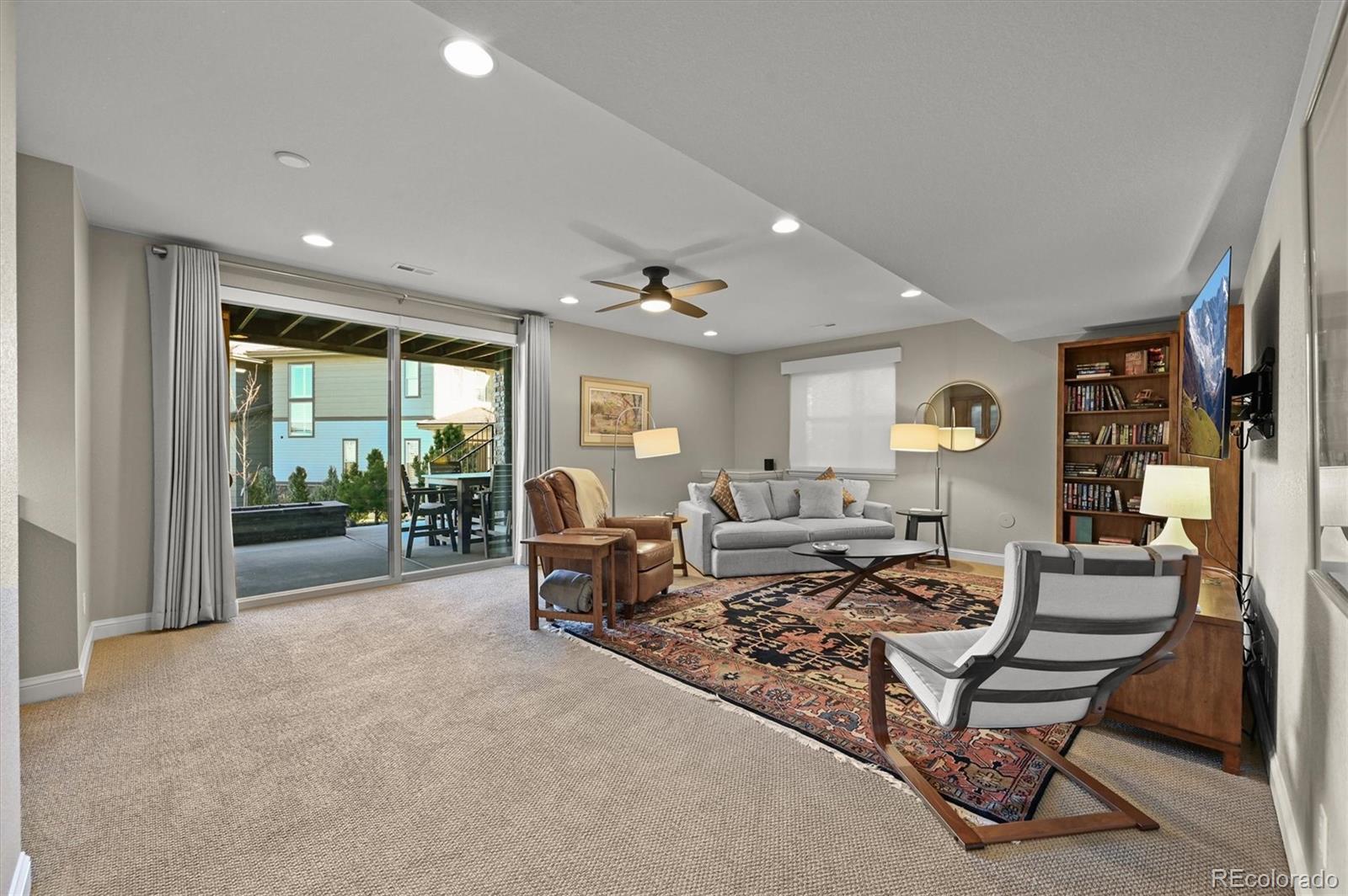 493 Meadowleaf Lane Highlands Ranch, CO 80126 - Photo 34 of 48 a living room with furniture and a large window