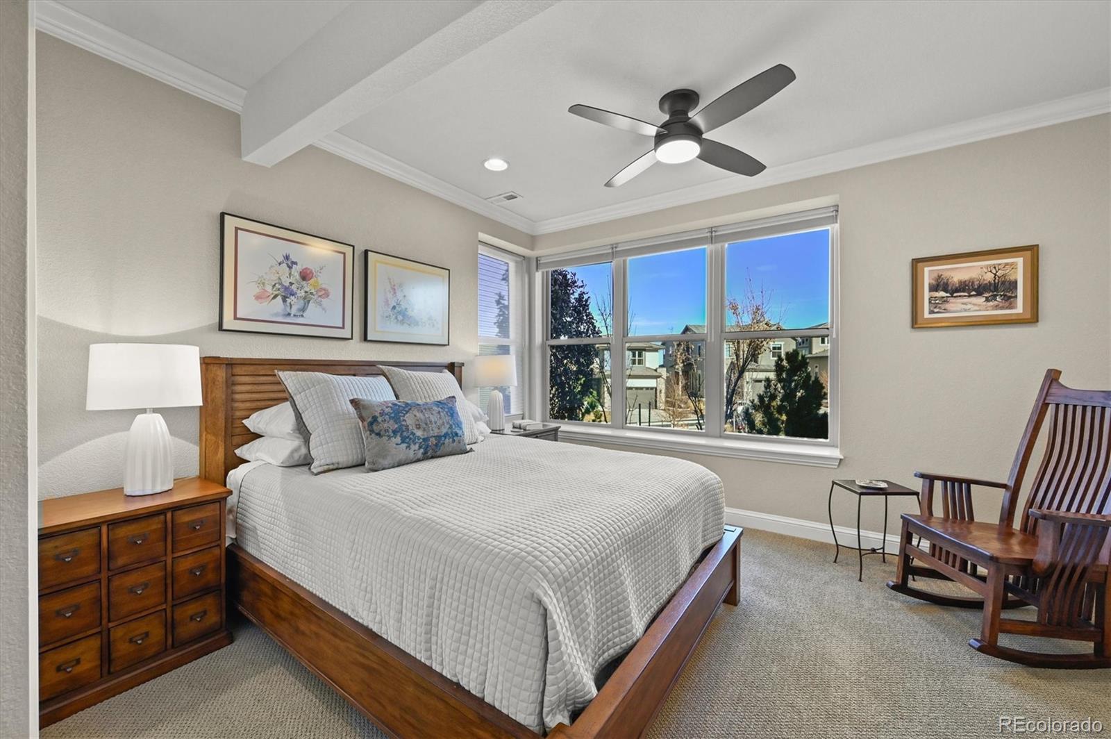 493 Meadowleaf Lane Highlands Ranch, CO 80126 - Photo 35 of 48 a bedroom with a large bed and a window