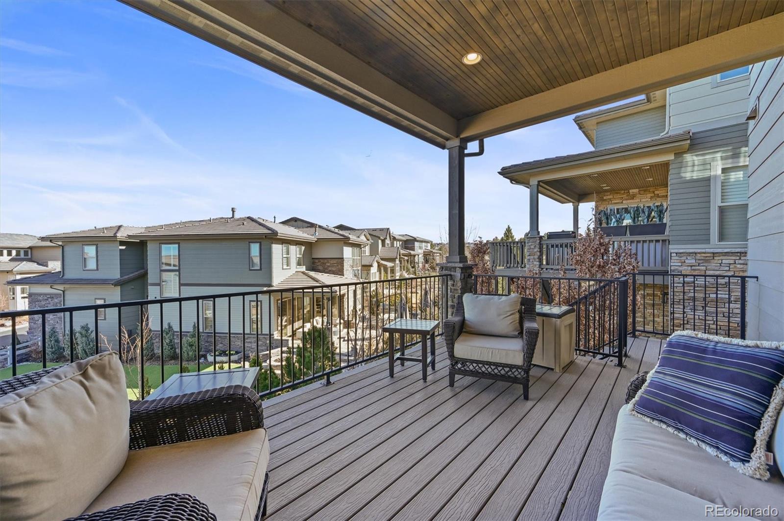 493 Meadowleaf Lane Highlands Ranch, CO 80126 - Photo 38 of 48 a balcony with furniture and wooden floor