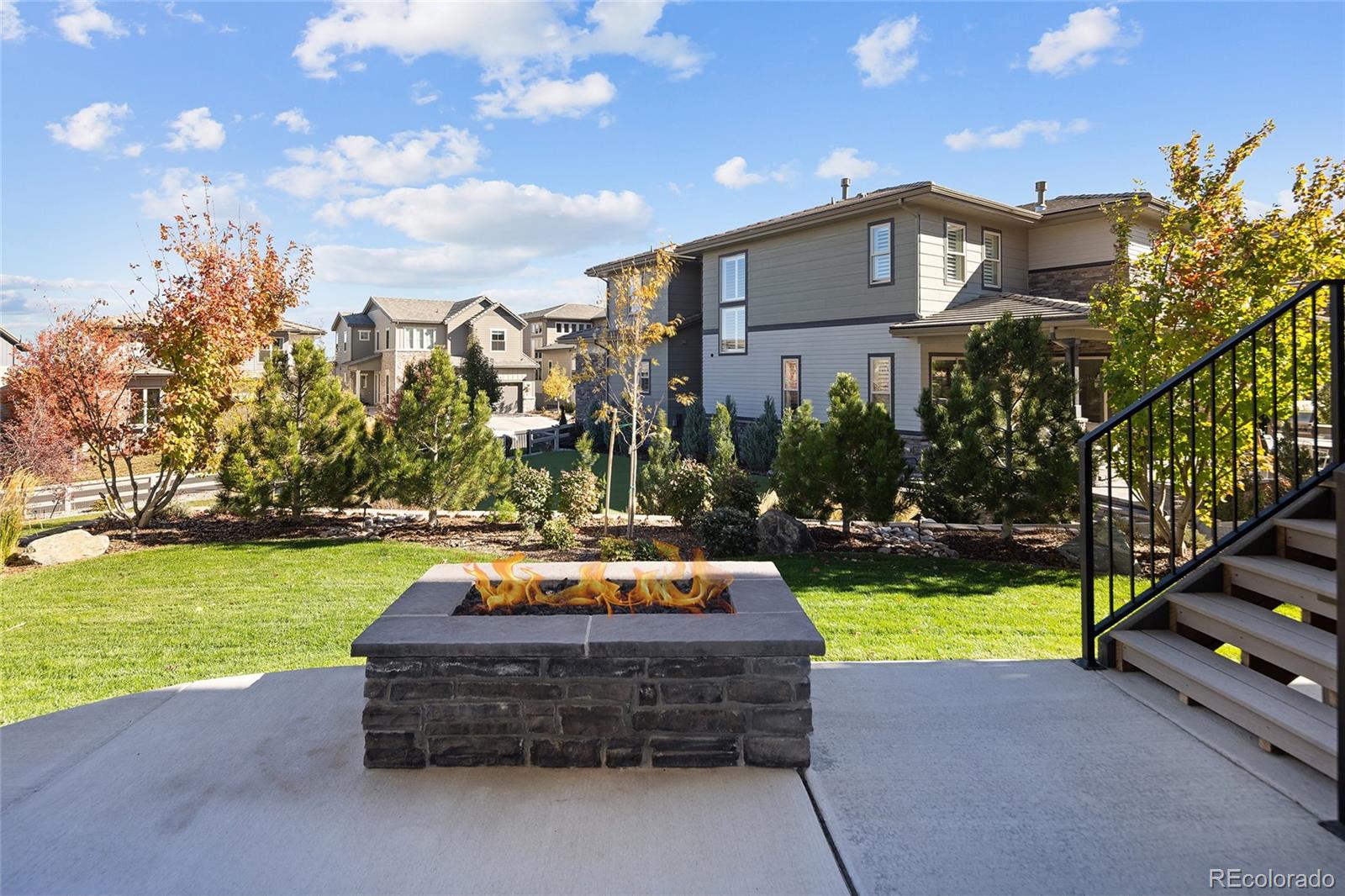 493 Meadowleaf Lane Highlands Ranch, CO 80126 - Photo 40 of 48 a view of a house with a yard patio and swimming pool