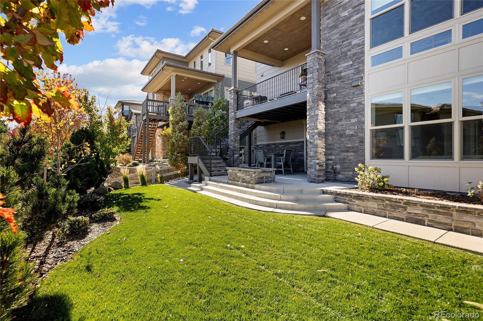 493 Meadowleaf Lane Highlands Ranch, CO 80126 - Photo 43 of 48 a view of a house with swimming pool and sitting area