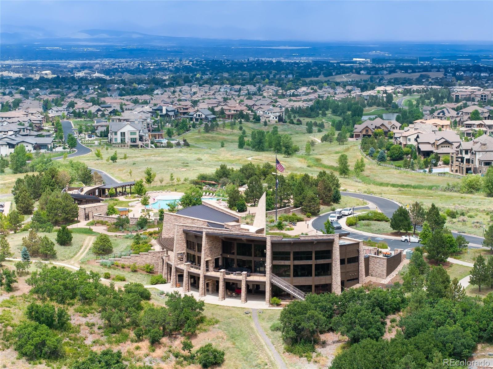 493 Meadowleaf Lane Highlands Ranch, CO 80126 - Photo 46 of 48 an aerial view of residential houses with outdoor space and lake view