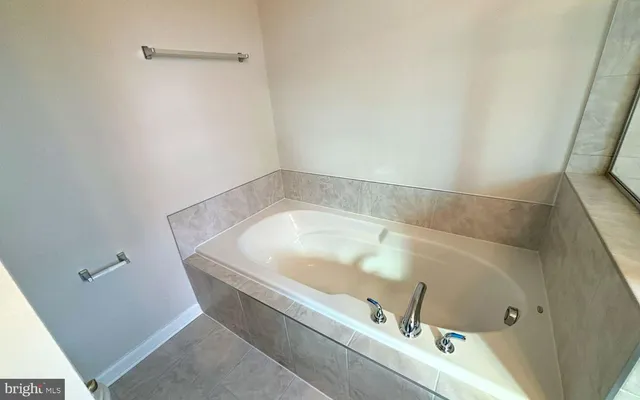 a bath tub sitting in a bathroom