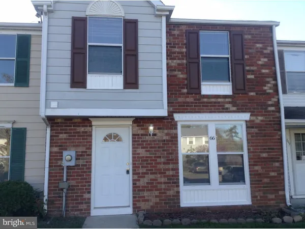 a front view of a building with glass windows