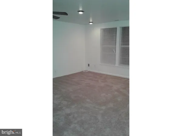 a kitchen with a sink and a washer dryer