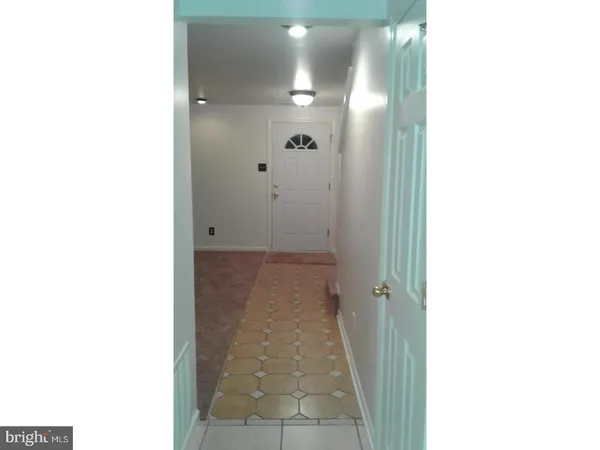 a view of a brick building next to a yard