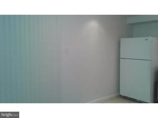 a view of an empty room with stairs