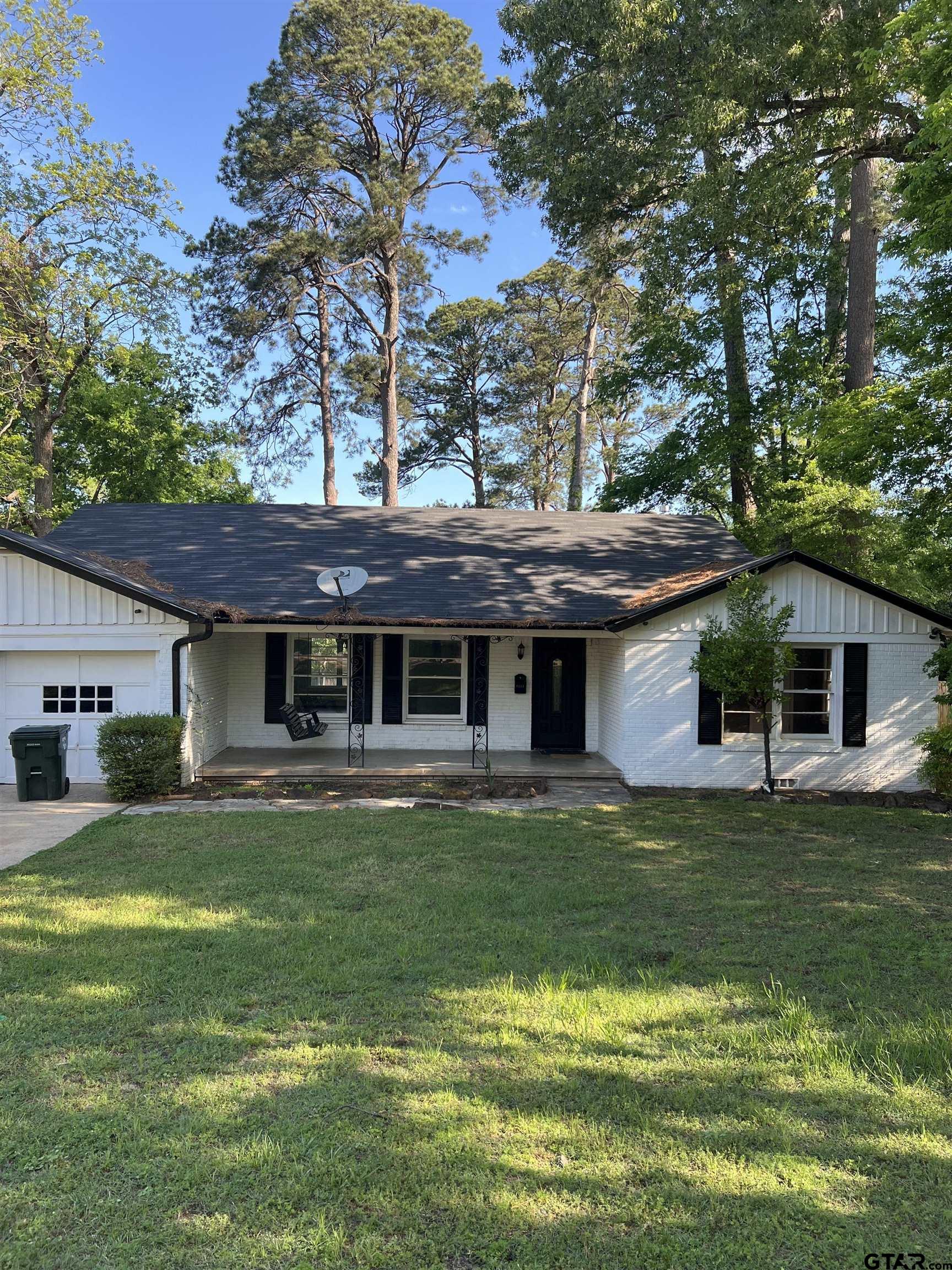 1223 South Azalea Drive Tyler, TX 75701 - Photo 2 of 11 a front view of a house with a garden