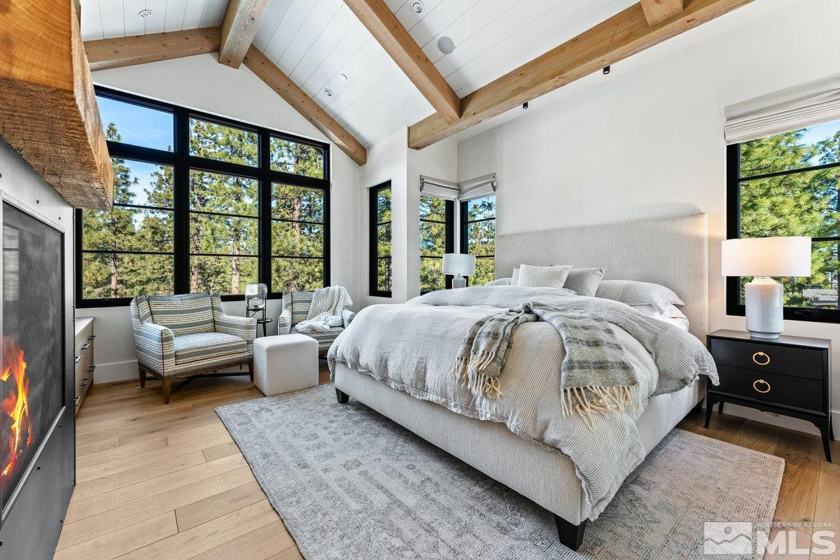 182 Tor Court Carson City, NV 89705 - Photo 13 of 40 a bed room with a bed couch and a large window