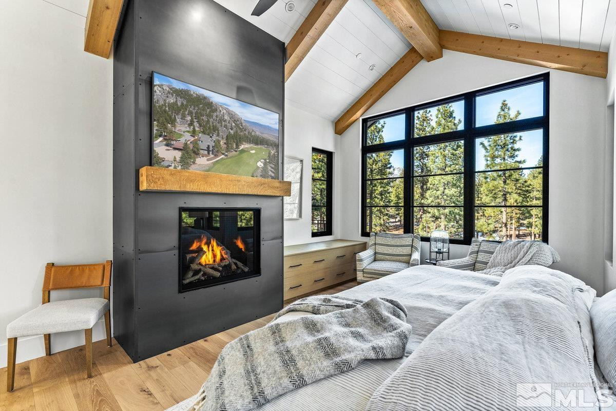 182 Tor Court Carson City, NV 89705 - Photo 14 of 40 a bedroom with a bed and a painting on the wall