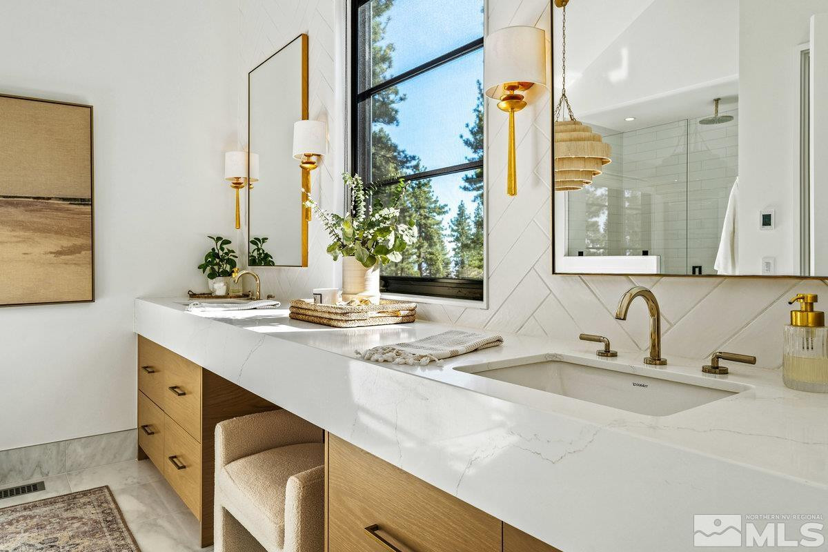 182 Tor Court Carson City, NV 89705 - Photo 17 of 40 a bathroom with a sink and a mirror