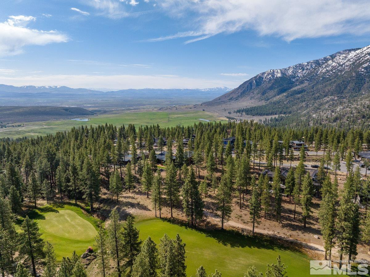 182 Tor Court Carson City, NV 89705 - Photo 3 of 40 a view of a lake with mountains in the background