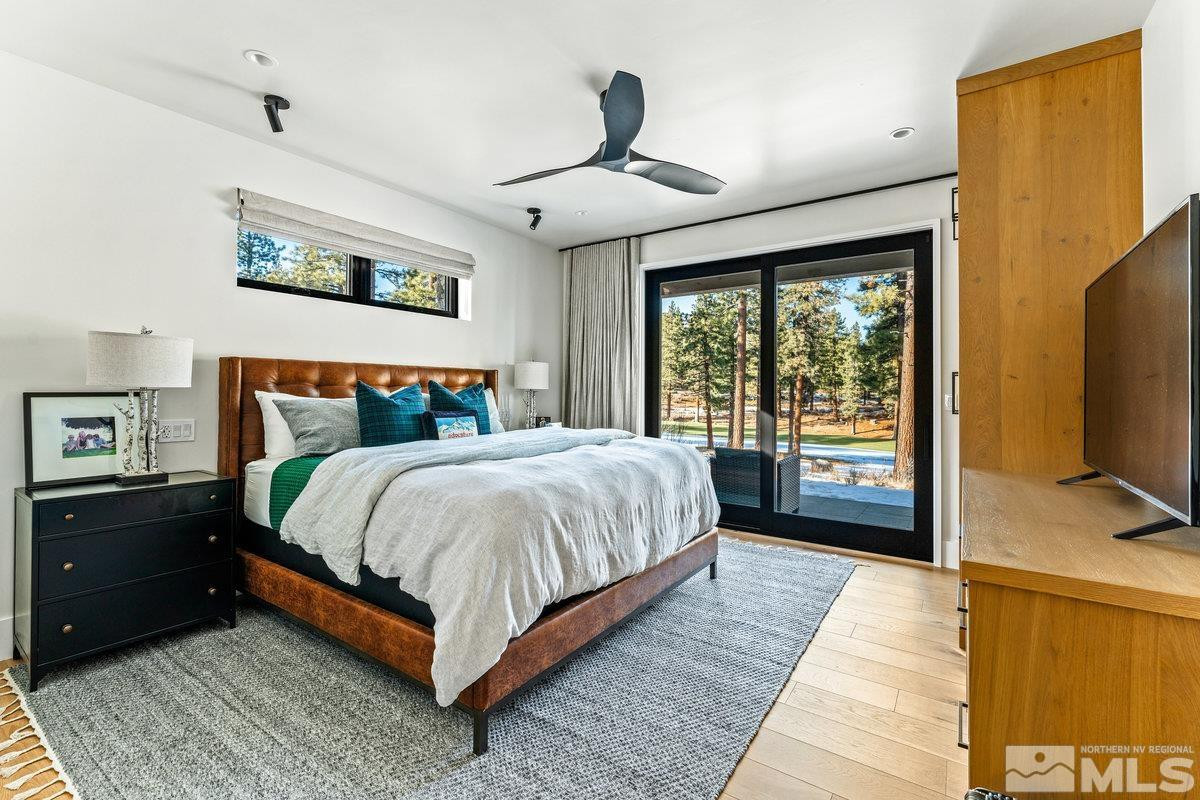 182 Tor Court Carson City, NV 89705 - Photo 31 of 40 a bedroom with a bed and a flat tv screen on dresser