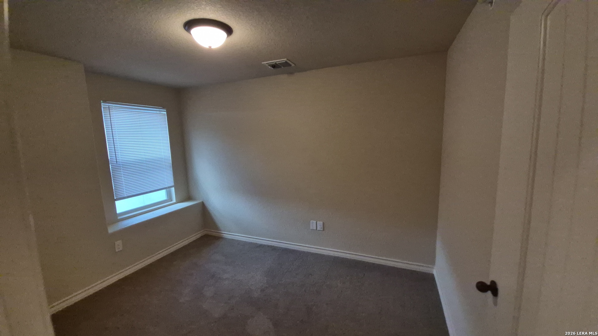 6414 Luglio Lane, Unit 101 San Antonio, TX 78233 - Photo 17 of 23 an empty room with windows