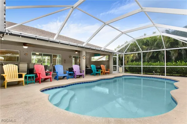 a view of a swimming pool with chairs