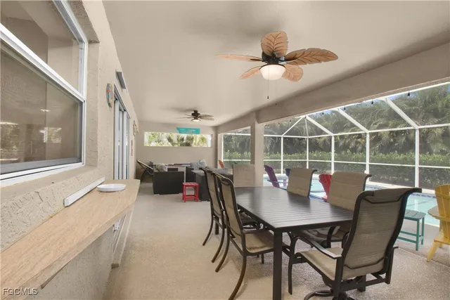 a view of a dining room with furniture window and outside view