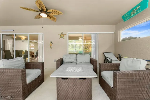 a living room with furniture and a window