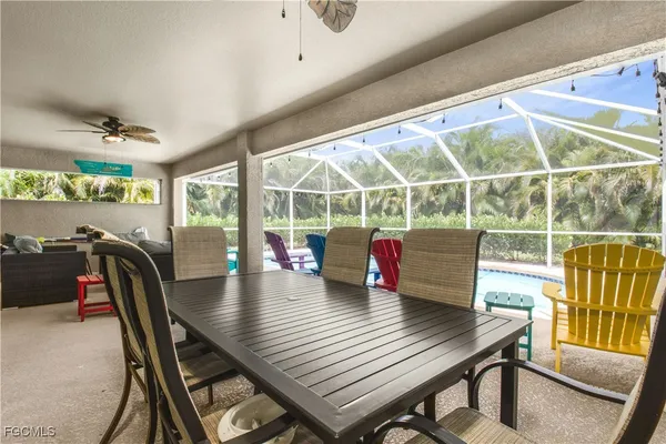 a view of a dining room with furniture window and outside view