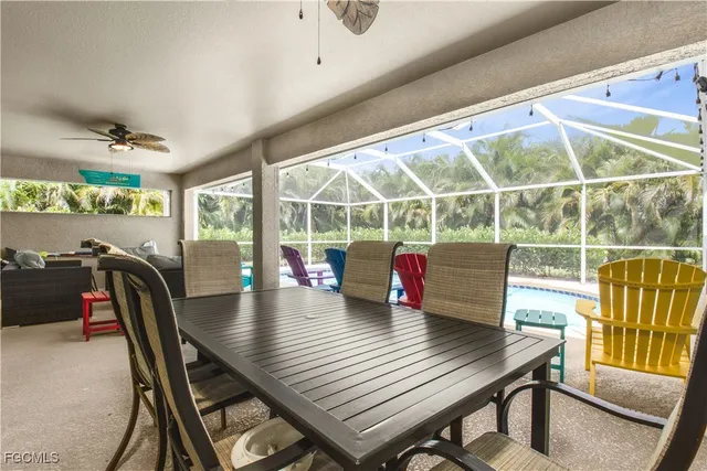 a view of a dining room with furniture window and outside view