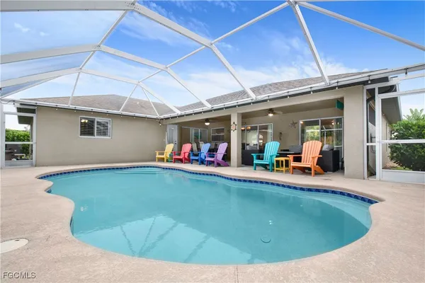a view of a room with furniture and a table