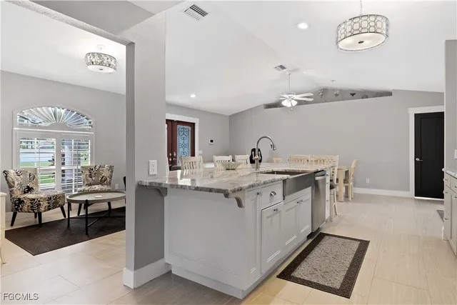 a kitchen with a sink and cabinets
