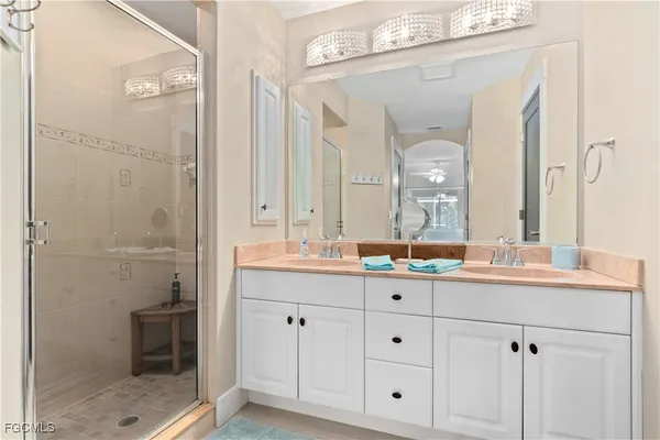 a bathroom with a granite countertop sink mirror and a