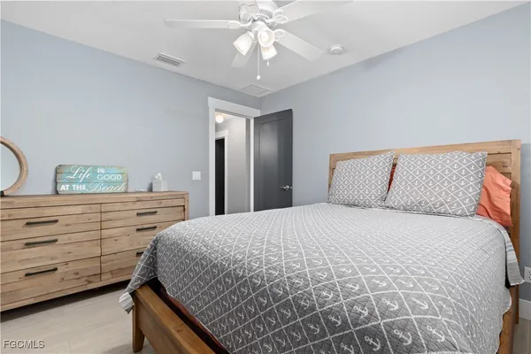 a bedroom with a bed and a dresser