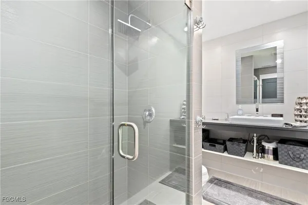 a bathroom with a sink and mirror