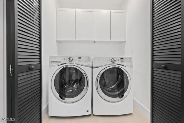 a utility room with dryer and washer