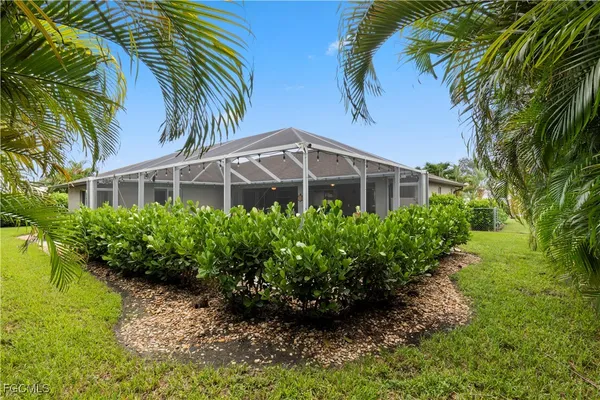 a view of a garden with a house