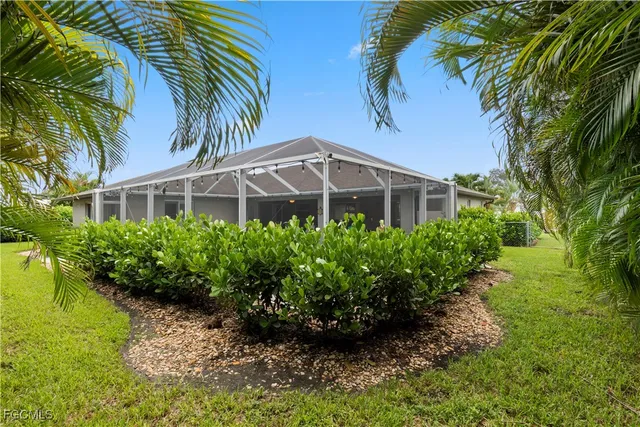 a view of a garden with a house