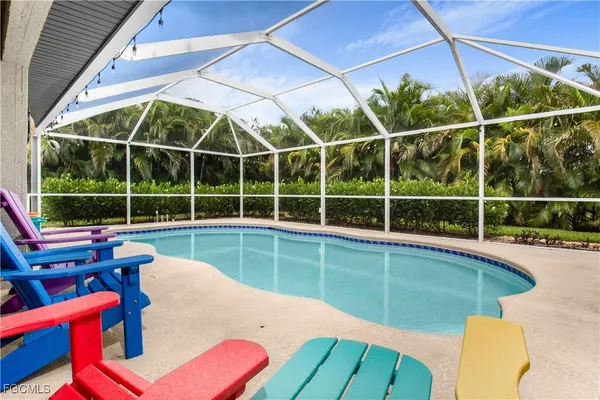 a view of a backyard with a swimming pool