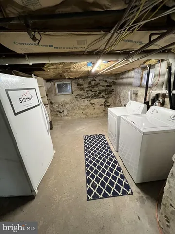 a view of a garden with wooden fence