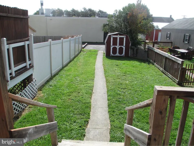 a view of a back yard from a balcony