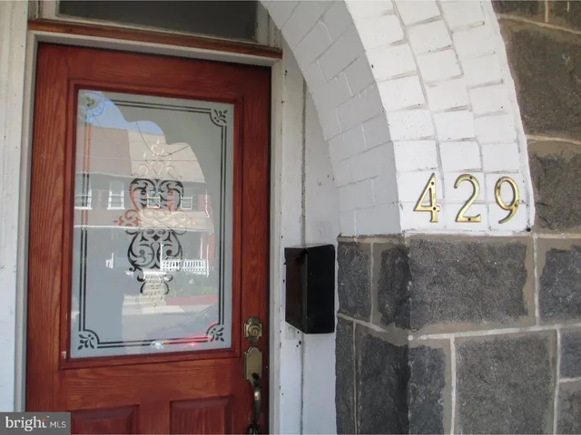 a front view of a house with stairs